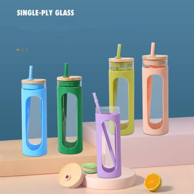 China Custom New Product 600ml Silicone Sleeve Bamboo Glass Water Cup Stocked Drinking Lid Tumbler With Straw for sale