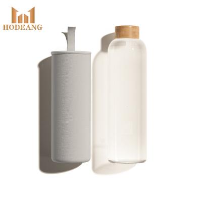 China Viable Custom Logo Eco-Friendly Bamboo Lid 500ml White Frosted Glass Water Bottle For Drinking for sale