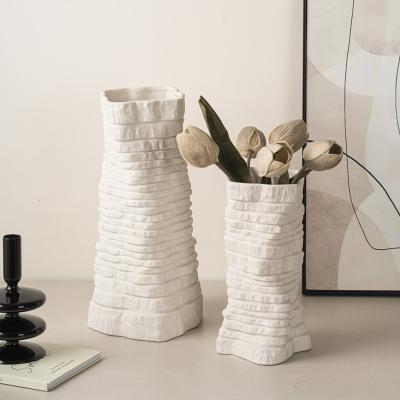 China Modern Minimalist Irregular Textured Custom Matte Clay Ceramic Flower Vase Wholesale Ceramic Artifact Vases for sale