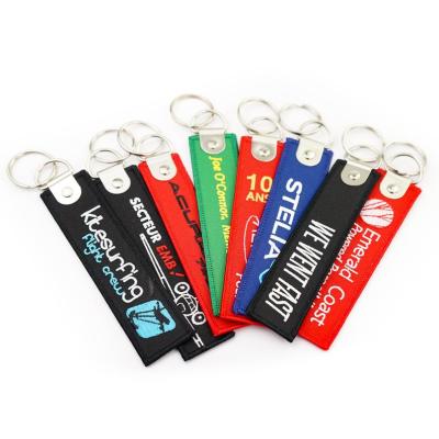 China Promotional Gift Promotion Style Insert Flight Embroidered Key Chain High Quality Custom Embroidery Key Chain zu verkaufen