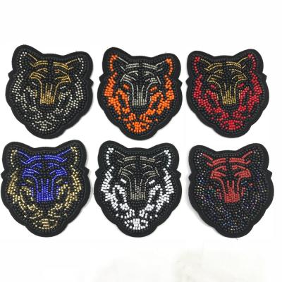 中国 custom colored 3D tiger head design beaded patches 販売のため