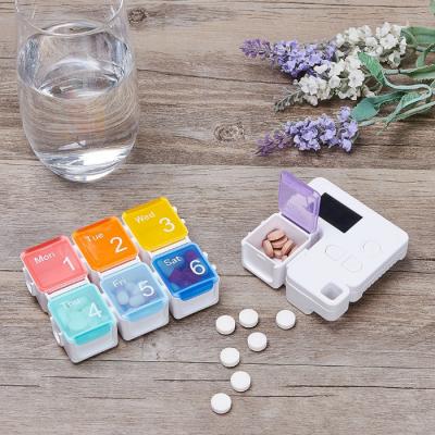 China Eco-friendly Weekly Pill Organizer Weekly Storage Timer Smart Pill Box Electronic 7 Day Medicine Box Dispenser Pill Organizer for sale