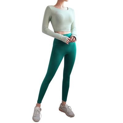 China New Breathable Yoga Suit Hollow-out Yoga Top And Peach Butt High Waisted Lifting Yoga Legging Sets For Women for sale