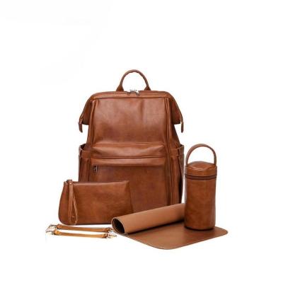 China With USB Customizable Wholesale Brown Leather Diaper Bag With 3Pcs Sets Mommy Diaper Backpack Hanging Bag for sale