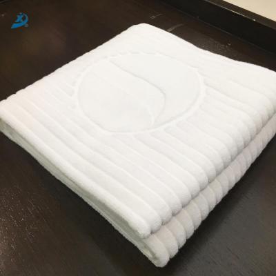 China Compressed Hot Sale White Cotton Terry Jacquard Hotel Hand Towel for sale