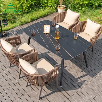 China Weather Resistant 2021 Popular Modern Outdoor Dining Table And Chair Brown Plastic Rattan Garden Furniture Dining Set for sale