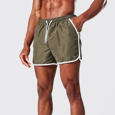 China Anti-wrinkle hot cake production fast runner shell shorts contrast trim army super short runner swim shorts for sale