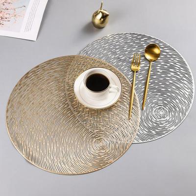 China Viable Heat Resistant Non Slip Washable Drink Coasters Round Place Mat PVC Gold Silver Dining Table Mats for sale