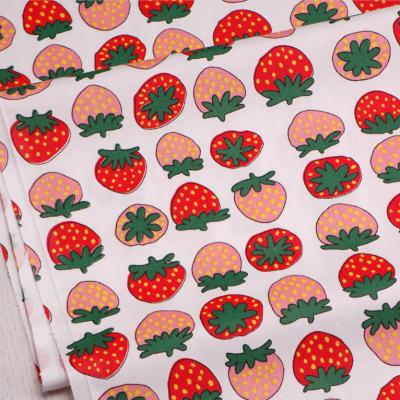 China Sustainable Red Strawberry Printed Soft Design Kids Bedding Dress Fabric In 160cm Width for sale