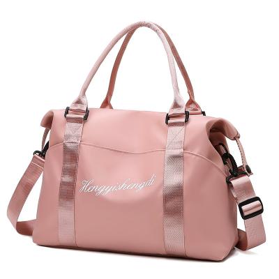 China Fashion Folding Duffle Bag Water Resistant Luggage Handbag Sports Gym Bag Nylon Carry On Travel Duffel Bag Pink Pink for sale