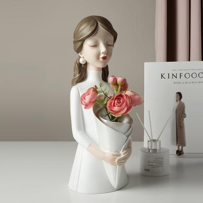 China China High Quality Home Decoration White And Pink Bride Carry Bouquet Resin Crafts Hand Made Statue For Wedding for sale