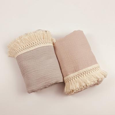 China Muslin Wearable 100% Organic Cotton Swaddle Fringe Tassel Newborn Wrap Sleeping Comforter Baby Blanket for sale