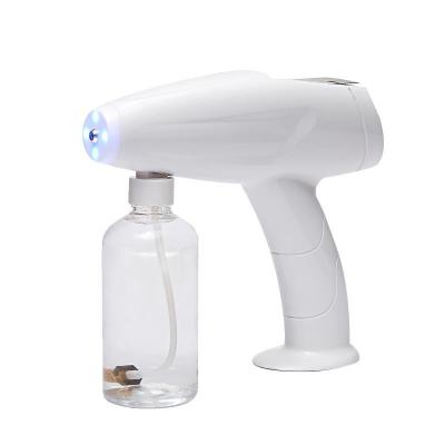 China Car Mini Wireless Electric ULV Sprayer, Portable Handheld Disinfection Vapor Gun Blue Light Nano Atomizer Machine for sale