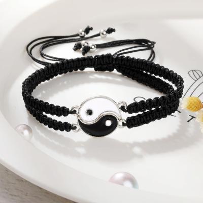 China Religious Handmade Yin and Yang Tai Chi Black and White Wax Tie Woven Bracelets Friendship Pulseras for sale