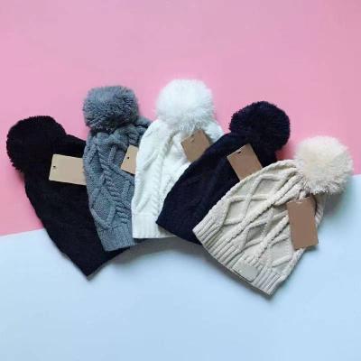 China Mid With Pack Women Winter Pom Poms Fur Ball Hat Knitted Beanies Brand Designer Warm Hat for sale