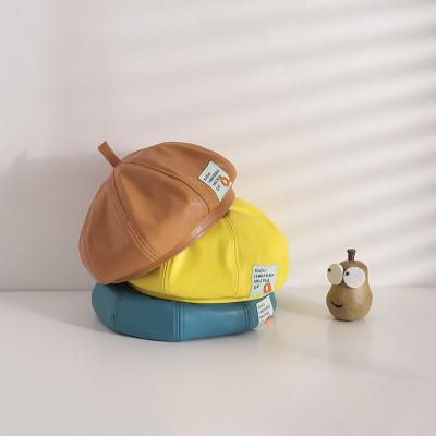 China XUFANG Dobby autumn and winter fashion children's hat PU boys the new and octagonal hat girls buckshot the label beret for sale