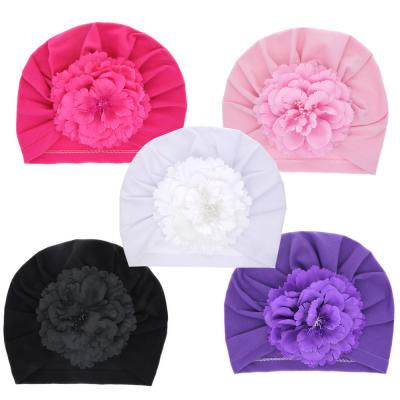 China XUFAN 2021 new fashion fetal dobby hat solid color head cap soft simulation flower knitted infant turban hats for sale