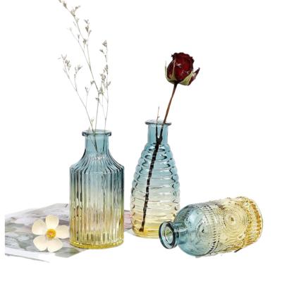 China Wholesale Unique Flower Bud Clear Glass Vase Design Transparent Empty Colored Glass Flower Vase For Flower Arrangements For Home Decoration for sale