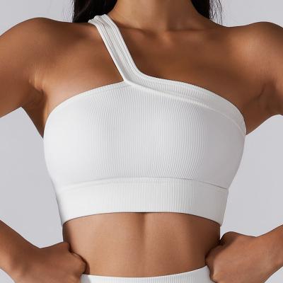 China Breathable Custom Yoga Bra Yoga Top Shirt For Women 2023 Women's Gym Fitness Sports Bra Elastic Band One Strap Slope Wide Lower Pad for sale