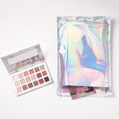 China Strong Colorful Glossy Plastic Makeup PVC Adhesive Aluminum Metallic Rainbow Foil Holographic Poly Mailers Mailing Bags for sale