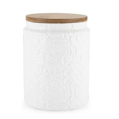 China Wholesale ebay handmade embossed modern hot sale simple logo white embossed design simple empty kitchen storage canister with white bamboo lid ceramic pot for sale