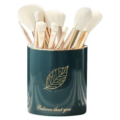 China Wholesale handmade embossed ebay gold decal logo simple white logo modern hot green glazed high quality wholesale ceramic makeup brush holder for sale