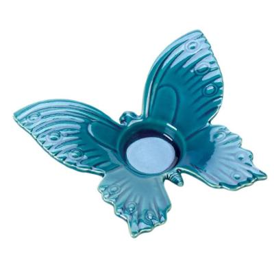 China Wholesale handmade embossed ebay simple modern hot sale butterfly shape candle holder blue glazed custom ceramic candlestick logo white for sale