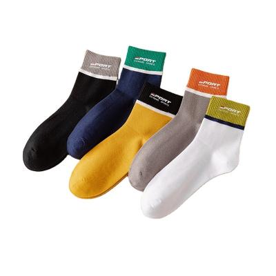 China Men's sports athletic high quality cotton thongs men's letter mid letter sporty gym socks warm tube stamping socks for sale