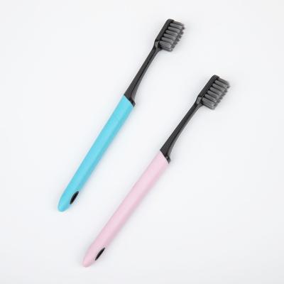 China Durable High Quality Charcoal Type Hard Stiffens Black Toothbrush for sale