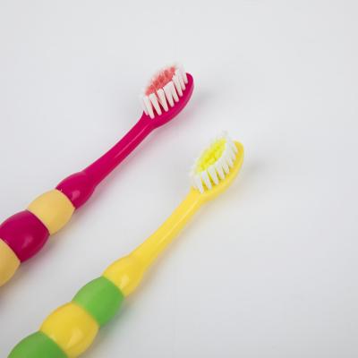 China New Arrival Color Cartoon Shape Soft Durable Type Stiffens Cute Kid / Child Toothbrush for sale