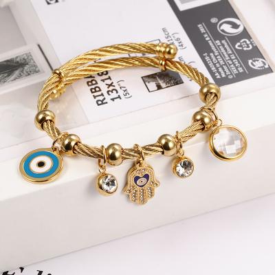 China 24K Gold Stainless Steel Fatima Hand Bracelet Titanium Steel Evil Eye Blue Eye Bracelet Nail Casual/Sport Jewelry for sale