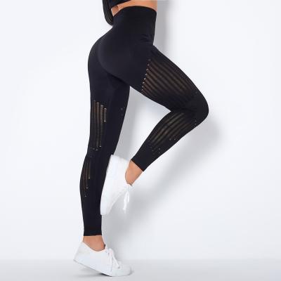 China Yoga Exercise Long Sleeve Quick-Drying Hole Mesh Seamless Leggings Fitness Yoga Pants Breathable Striped Seamless Workout Suit for sale