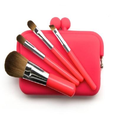 China Angular Blush Promotional 4pcs Mini Travel Makeup Brushes Set Cosmetic Brush with Pocket Carry Bag for sale