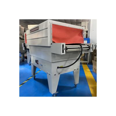 China Full Automatic Commodity Tunnel Winding Packaging Machine PVC Film Heat Shrink Packaging Machine for sale