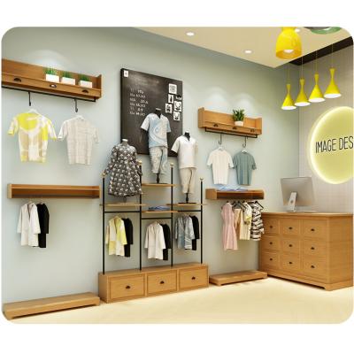 China Minimal Art Wood Clothing Store Furniture For Children's Clothing Store for sale