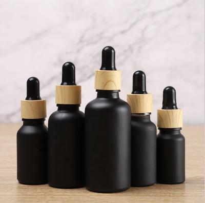 China Black Colored Cosmetic Empty Essential Oil Matte Glass Eye Dropper Bottle 5ml 10ml 15ml 20ml 30ml 50ml 100ml With Dropper for sale