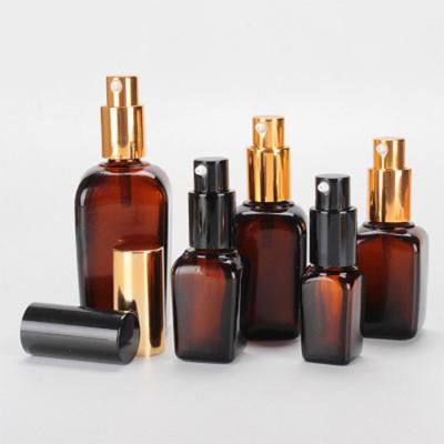 China 15ml 25ml 35ml 50ml 100ml Essential Oil Dropper Spray Bottle Essential Oil Amber Square Glass Bottle with Gold and Black Spray for sale