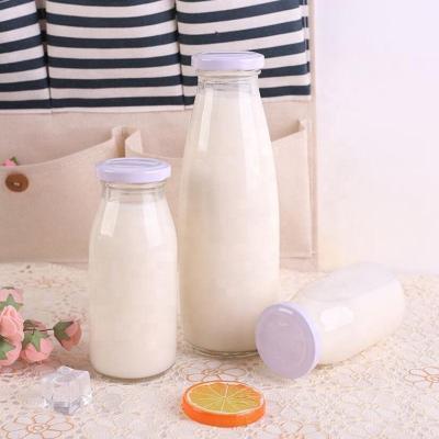 China 100ml 200ml 250ml 350ml 500ml Beverage Milk Pudding Glass Bottle Juice Yogurt Beverage Glass Bottle With Lid for sale