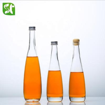 China 300ml 500ml clear juice wine bottle milk tea glass stocked bottle with rubber stopper or aluminum cover for sale