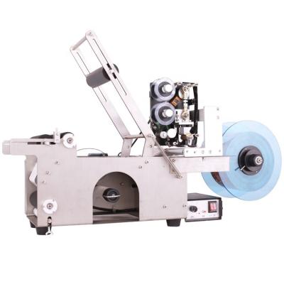 China Food sticker automatic table top labeler labeling machine small semi-automatic gun for sale