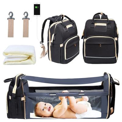 China With USB Diaper Bag Backpack With Foldable Waterproof Crib Mummy Bag With Changing Station USB Charging Port for sale