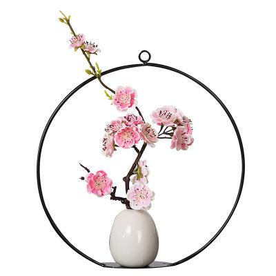 China Modern Creative Wall Hanging Iron Circle Triangle Wall Gold Metal Sculptures With Flowers Wall Decoration for sale