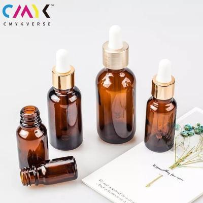 China Cosmetic All Size Essential Oil Glass Bottle Luxury Gold Cosmetic Dropper Glass Bottle For Make Up for sale