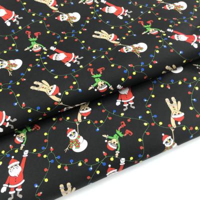 China Exclusive 100% Santa Claus Print Anti-Static Woven Fabric Christmas Cotton Fabric for sale