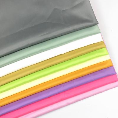 China Wholesale Fusible Polyester Fluorescence Silk Color Taffeta Single Coating Fabric for sale