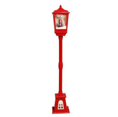 China Eco-Friendly Western Pillar Lamp Indoor Christmas Light Flickering Lantern Christmas Ornaments Music Snowfall Floor Lamp for sale