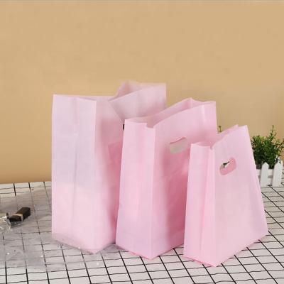 China Matte Clear Plastic Packaging Bag Disposable Shopping Carry PVC Die Cut Poly Bag Custom Bags With Handle for sale