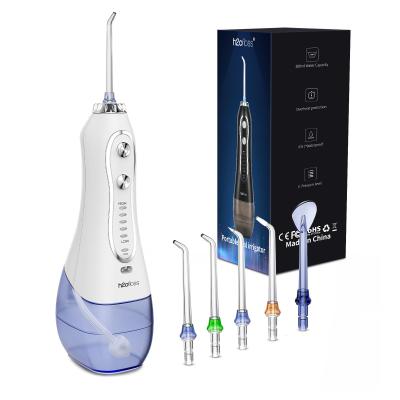 China Flosser de agua dental con regador oral 1200-1400 veces/min Con tanque de agua de 300 ml en venta