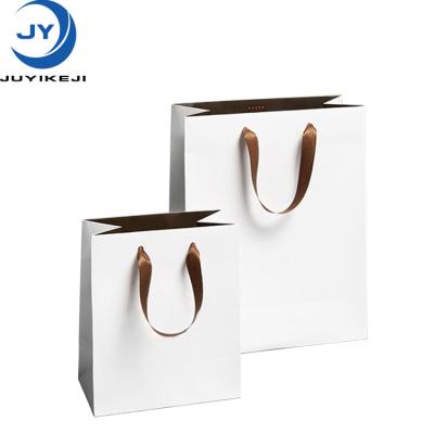 China Recycled Materials Wholesale Luxury Shoes Clothes Kraft Paper Bags Printed Logo Custom Packaging Paper Bag Clothing Shopping Gift Jewelry for sale