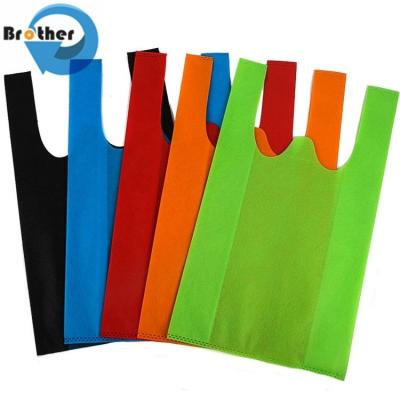 China Promotional PP Non Woven TNT Bags/Polypropylene Nonwoven T Shirt Bags Bag/W-Cut Non-Woven Vest Carrier Shopping Bag for sale